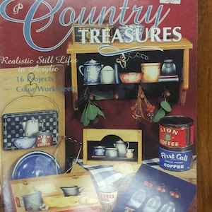 May include: A book titled "Country Treasures" by Bobbie Campbell, featuring 16 realistic still life painting projects in acrylic. The cover shows a variety of country-themed objects, including coffee cans, jars, and a wooden shelf.