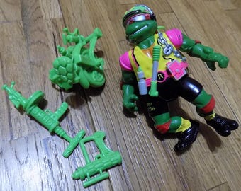 Figura de acción de Raphael de las Tortugas Ninja en bicicleta por las alcantarillas - Juguete de Playmates de los años 90