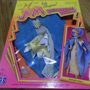 Jem y los hologramas ¡Realmente escandalosos! Atuendo Nueva tarjeta sellada Muñecas Muñecas Juguete Figura de acción Gem Glitter N Gold Modas Magia de medianoche
