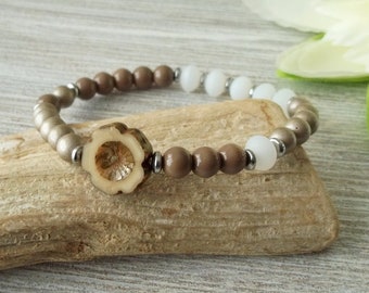 Glass bead bracelet with flower in brown tones