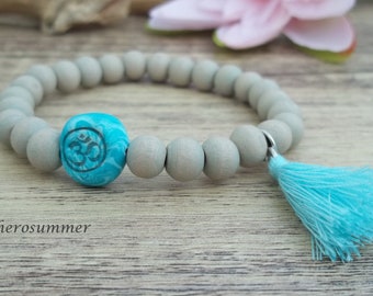 Yoga wooden pearl bracelet with omm sign and tassel turquoise