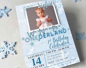 May include: A light blue birthday invitation card featuring a photo of a child, snowflake patterns, and the text Sophia's Winter Onederland 1st Birthday Celebration, Saturday 14 January, 7:00 PM - 10:00 PM, 123 Anywhere St., Any City, ST 12345, RSVP: 123-456-7890.