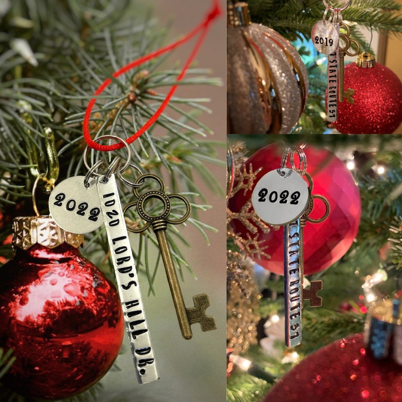 custom new home ornament, housewarming gift for new homeowners, red velvet ribbon, antique skeleton key, shown hanging on a Christmas tree branch