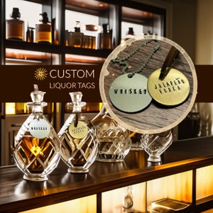 May include: Custom liquor bottle tags with the words "Whiskey" and "Jalapeno Vodka" on them. The tags are made of metal and have a rustic look.