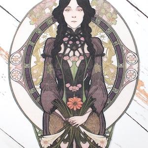 May include: An Art Nouveau style illustration of a woman with long black braids, holding a bouquet of flowers. The woman is framed by an oval design with floral and geometric patterns in shades of purple, green, and beige.