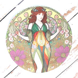 May include: Circular coaster with an Art Nouveau design. It depicts a woman with red hair and a floral crown, wearing a green, orange, and rainbow dress. The background is a floral, stained-glass style pattern.