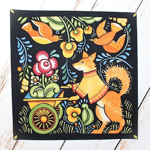 May include: A colorful folk art print on black background. The illustration features a fox in a yellow coat pushing a wheelbarrow filled with flowers. Orange birds and floral elements surround the fox, with green, red, and yellow accents.