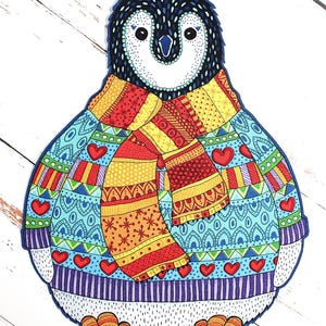 May include: A colorful illustration of a penguin wearing a patterned sweater and scarf. The penguin has a black head, white face, and orange feet. The sweater is light blue with red hearts, and the scarf is red, yellow, and orange.
