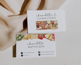 May include: Two business cards with the text "charolotte & charcuterie" and "charolotte matthison". The cards feature watercolor illustrations of charcuterie boards with cheese, fruit, and meats. Contact information is included.
