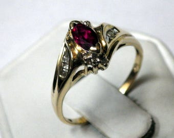 VINTAGE RUBY LADIES Ring with diamond accents mounted on solid cast 14K yellow gold ring