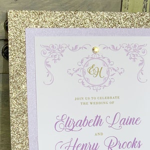 May include: A wedding invitation with a gold glitter background, a lavender border, and a white card with a purple floral design. The card says "Join us to celebrate the wedding of Elizabeth Laine and Henry Brooks".