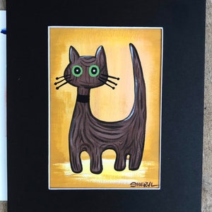 May include: A brown cat with green eyes and a black collar stands on a yellow background. The cat has a wooden texture and is drawn in a stylized manner. The artist's signature, "SHERYL", is in the bottom right corner.