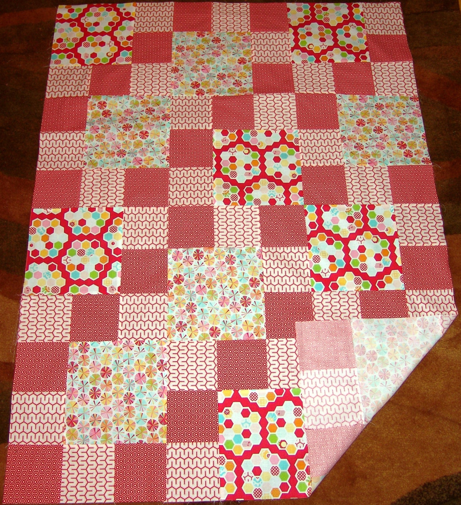 Baby/lap Quilt TOP Featuring Riley Blake Fabrics in Geometric Shapes. in Red and Pink as Main
