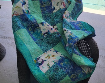 Quilt made with sea creatures great for the lake or coastal cottage. 48 x 58 inches