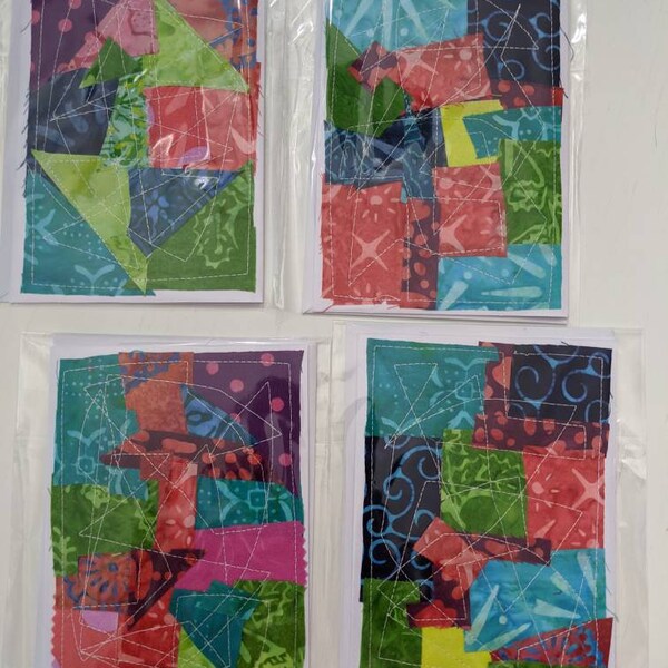 Quilted note cards 4 to a pack.  4 x 6 inches.  Fabric sewn black notecards.  Batik in multicolored