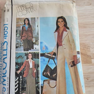 May include: Vintage sewing pattern for women's suits and jackets. The pattern features multiple images of women wearing different suit styles. The pattern is labeled "McCall's 4651" and includes the text "Mario's Corner".