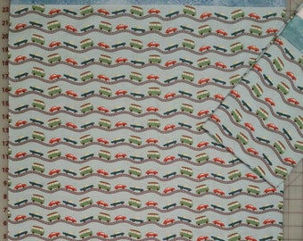 Pillowcase,  Teal, green and red cars on grey roads in a light blue background with trim at opening. Standard size.