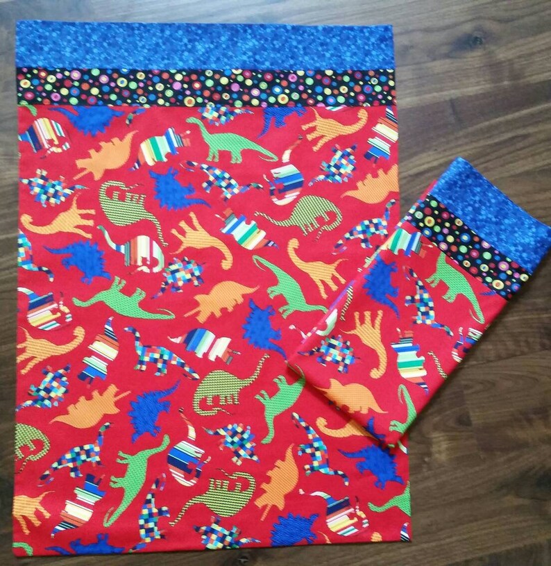 Dinosaur standard size pillowcase. Red background with Etsy