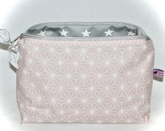 Cute toiletry bag in pink, gray and silver with a graphic pattern and stars