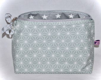 Toiletry bag in mint green and gray with a graphic pattern and stars