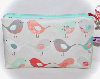 Cosmetic bag with name and bird in turquoise red