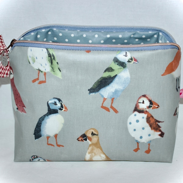 Cute toiletry bag with puffins made of oilcloth