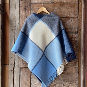 Blue lambswool poncho cape in check Blue/white hooded poncho Long wool poncho cape in check Pure lambswool poncho warm and light breathable