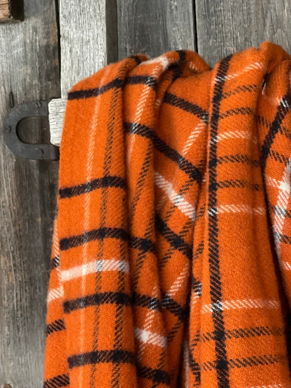 Orange check throw deals