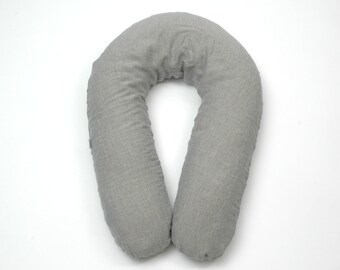 May include: A gray U-shaped pregnancy pillow with a textured fabric cover.