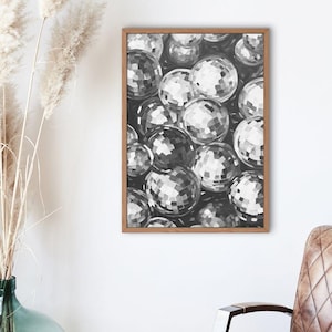 May include: A framed black and white illustration of a cluster of disco balls.