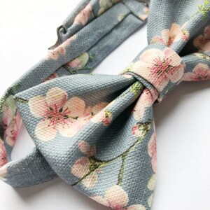 Mens cherry blosom bow tie, in bluey grey linen with a pink floral print. image 4