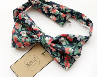 Men’s navy and coral bow tie handmade using floral Liberty cotton.