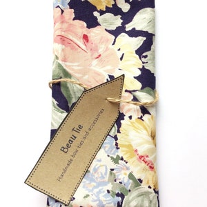 Mens floral pocket square in navy blue/indigo cotton with pink and yellow large rose print.