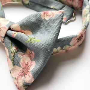 Mens cherry blosom bow tie, in bluey grey linen with a pink floral print. image 3