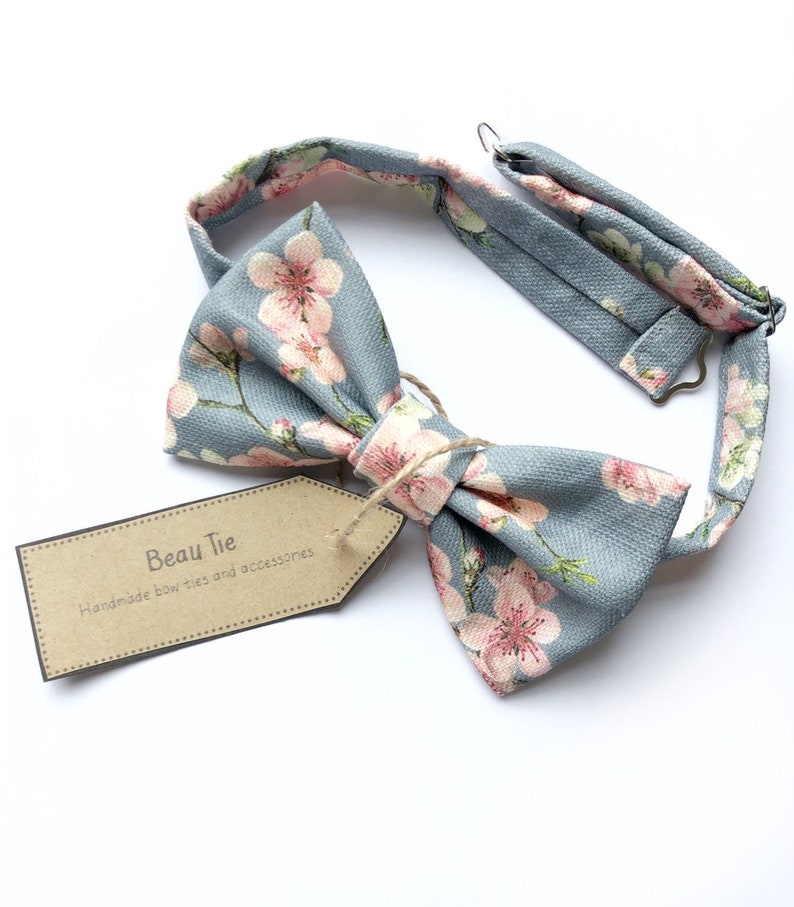 Mens cherry blosom bow tie, in bluey grey linen with a pink floral print. image 1