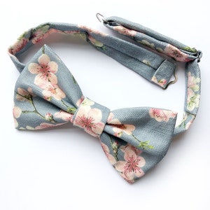 Mens cherry blosom bow tie, in bluey grey linen with a pink floral print. image 2