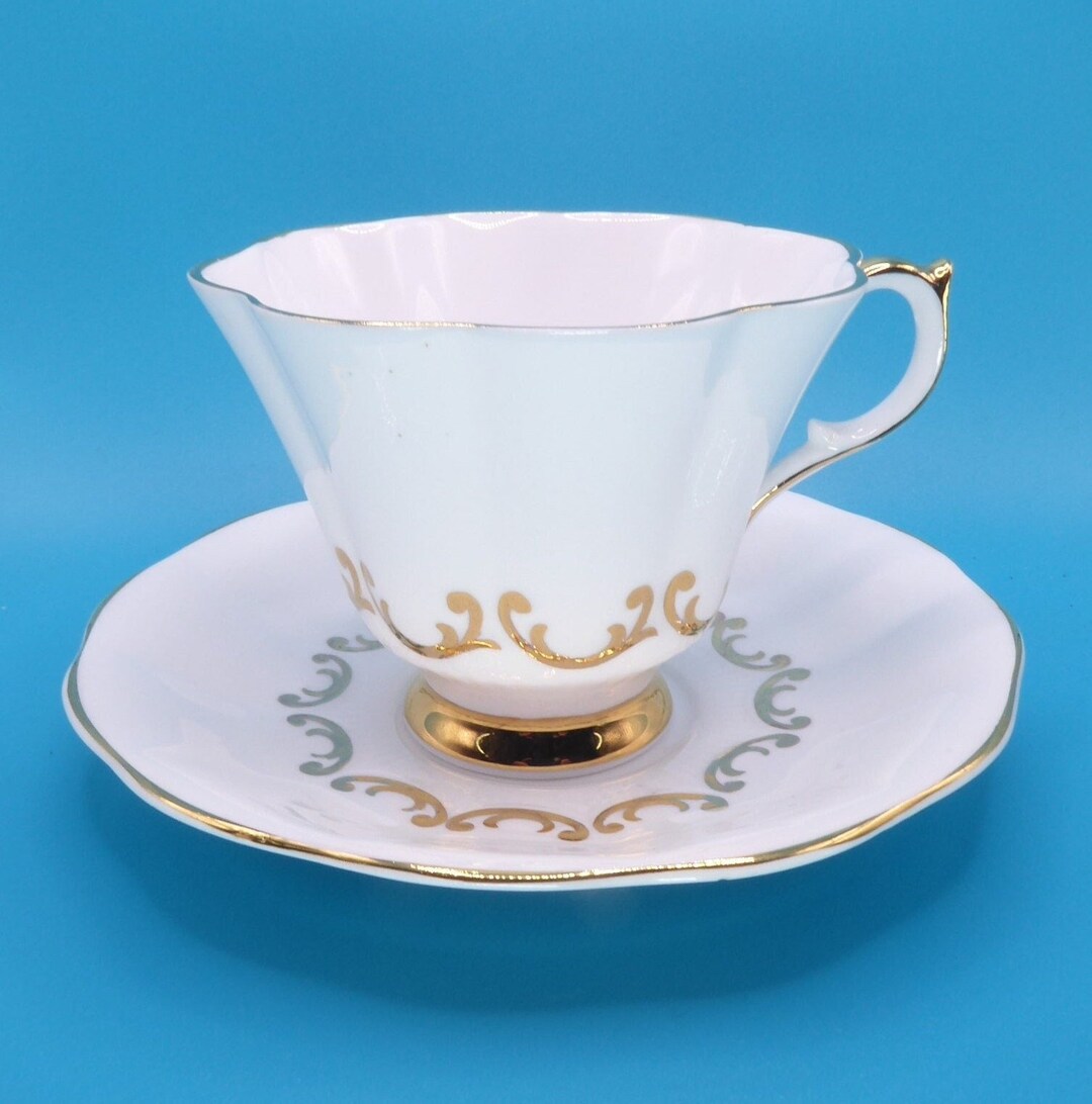 Elegant Queen Anne White and Gold Tea Cup and Saucer, Vintage English