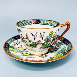 Antique Crown Staffordshire hand painted tea cup and saucer set