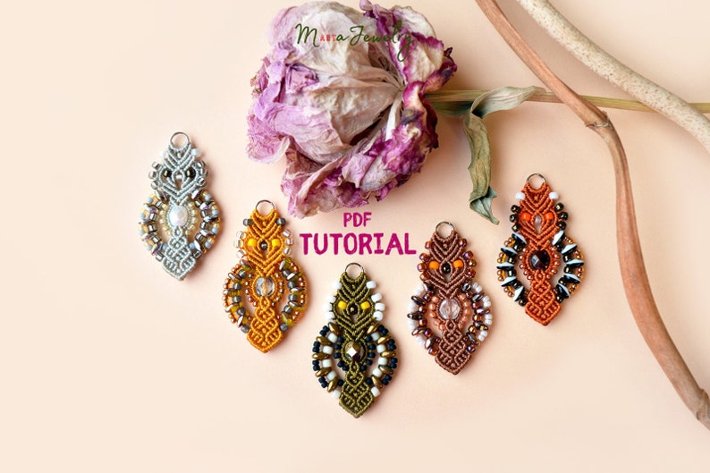 May include: Five colorful macrame earrings with beads and a crystal charm. The earrings are arranged in a row on a light pink background. The text "PDF TUTORIAL" is written in white letters on a pink background.