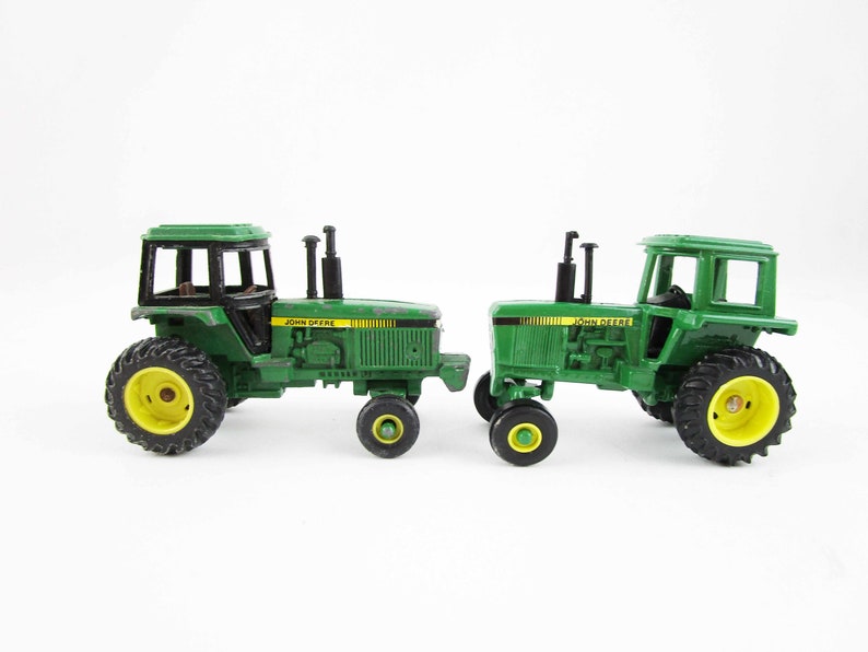 Metal Toy Tractors >> Two John Deere Miniature Tractors 1 64 Scale Metal Toy Unmarked Ertl Dyersville Iowa Collectible Farm Metal Toy Tractors >> Two John Deere Miniature Tractors 1 64 Scale Metal Toy Unmarked Ertl Dyersville Iowa Collectible Farm