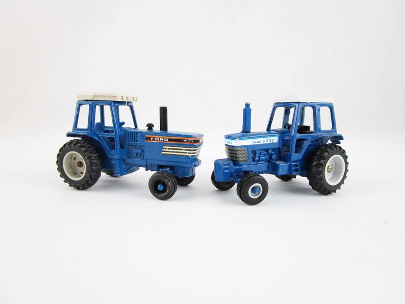 Metal Toy Tractors >> Two Ford Miniature Tractors 1 64 Scale Metal Toy Model Tw 20 And Tw 35 Ertl Dyersville Iowa Collectible Farm Metal Toy Tractors >> Two Ford Miniature Tractors 1 64 Scale Metal Toy Model Tw 20 And Tw 35 Ertl Dyersville Iowa Collectible Farm