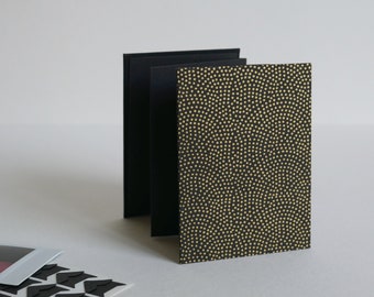 Black and gold polka dot mini album, accordion album for mini instant photos. 8x11 cm, 10 black pages.