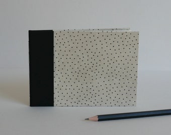 Italian notebook, 14.5x10.5 cm, 40 blank pages. Nepalese paper cover lokta, peas, black and white