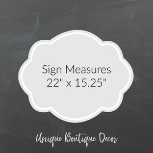May include: A white sign with a gray cloud shape and black text that reads "Sign Measures 22" x 15.25" and "Unique Boutique Decor".