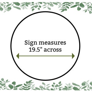 May include: A white circle with a black outline and the text "Sign measures 19.5" across" with a green arrow pointing to the left and right. The circle is surrounded by a border of green watercolor leaves.