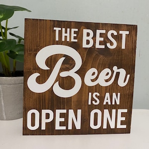 The best beer is an open one - beer sign - funny drinking quote - farmhouse saying wood decor - bar cart signs - home bar drinks decor
