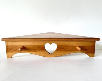 Vintage pine corner shelf with pegs and heart cutout