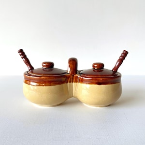 May include: A rustic wooden sign with the text "Welcome to our porch" in white lettering. The sign features a distressed finish and a simple, inviting design, perfect for outdoor decor.