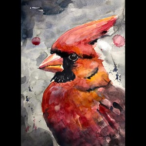 Peut inclure: Peinture à l'aquarelle d'un cardinal rouge vif avec un masque et un bec noirs. L'oiseau est posé sur un fond gris et blanc avec des éclaboussures de peinture rouge et noire. L'œuvre est signée.
