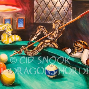 May include: A painting of a green pool table with three snakes playing pool. One snake is holding a pool cue and is about to hit a white ball. The other two snakes are coiled up on the table. The painting is signed "Cid Snook The Dragon's Horde".